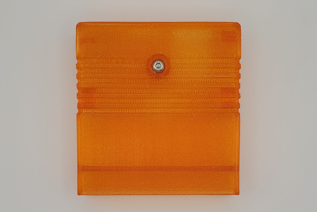 TeensyROM cartridge case in orange, bottom view