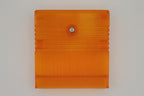 TeensyROM cartridge case in orange, bottom view