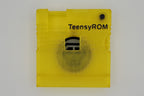 TeensyROM cartridge case in yellow, top view showing transparency