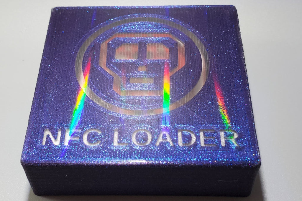 0ldSkull NFC reader, top front view showing holographic effect