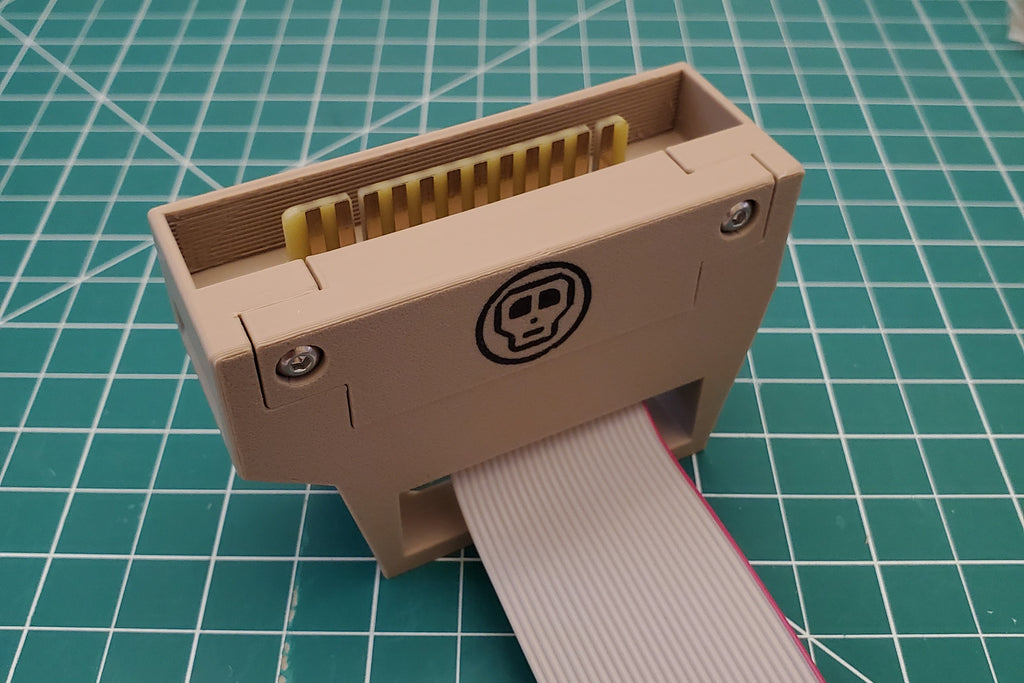 Vertical user port retainer installed with adapter and cable