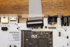 User port cable threaded into C64U cassette port opening
