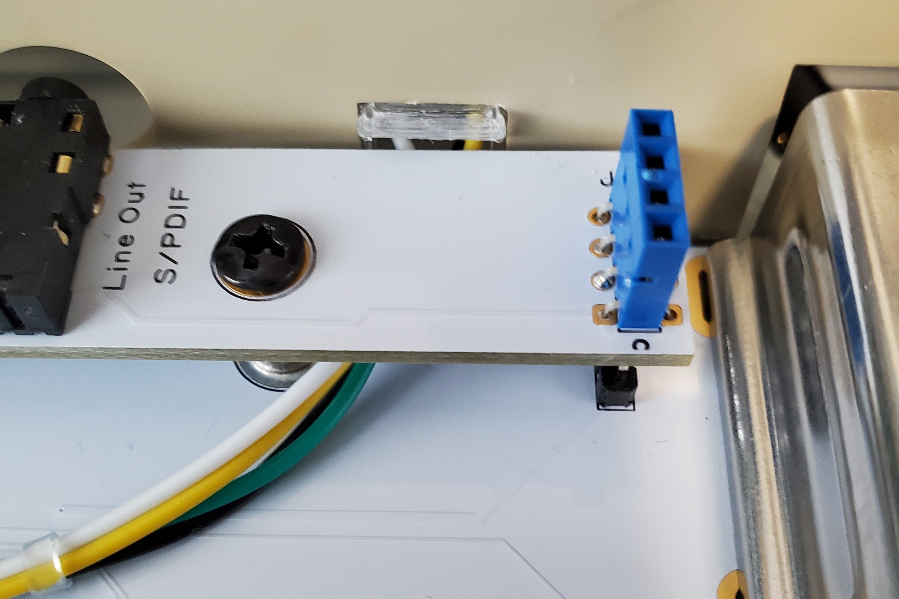 64C Ultimate utility buttons inserted in case hole